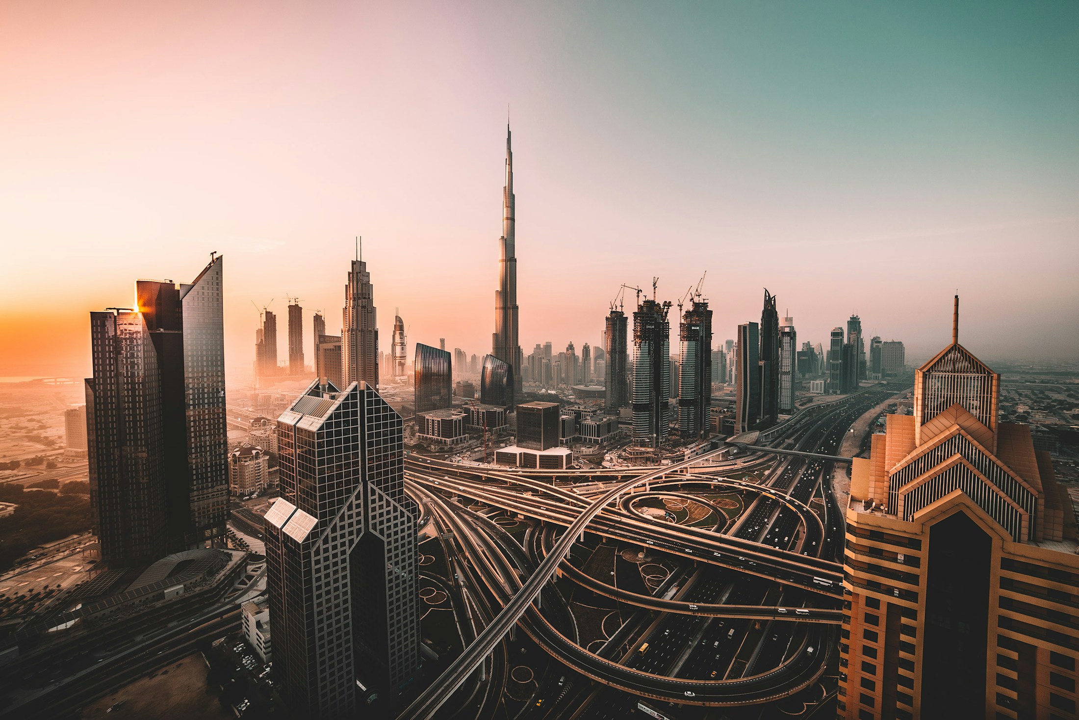 Dubai skyline and Burj Khalifa overlooking the city at sunset